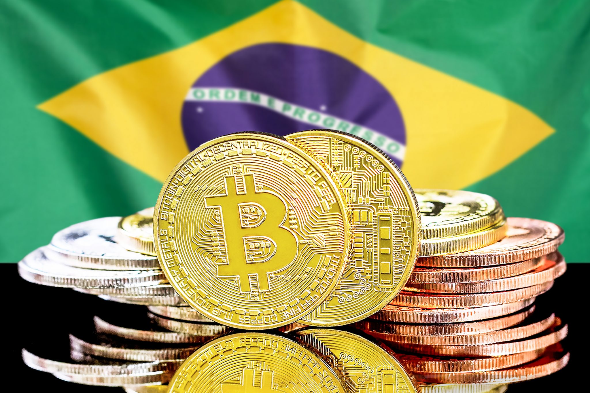 bitcoins on Brazil flag background